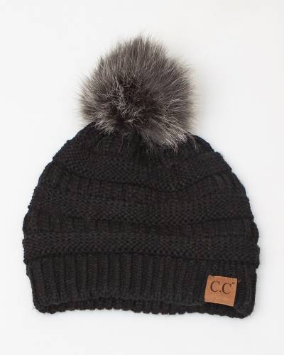 black hat with brown fur pom pom