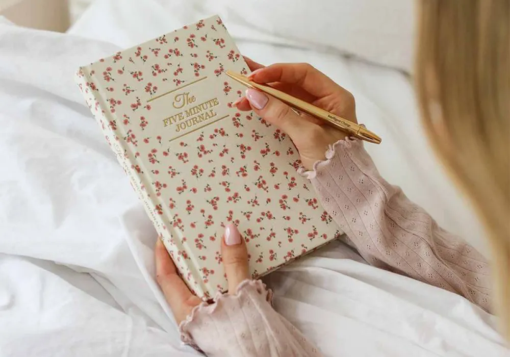 Image of cream Five Minute Journal with red flowers. Soul Care- Shop Now